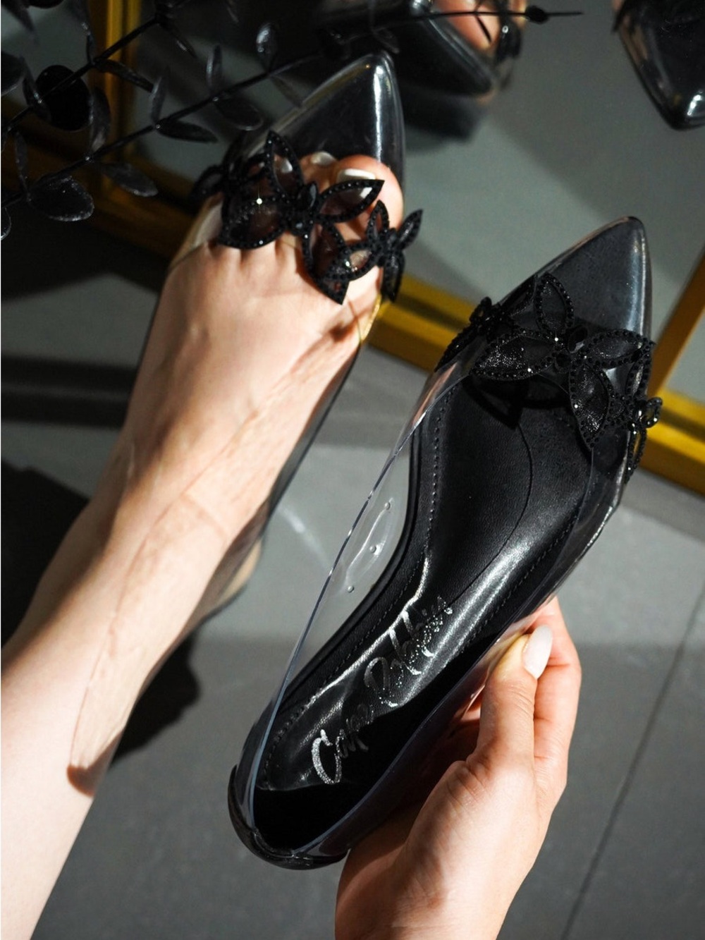 Cape Robbin Black Pointed-Toe Flats with Floral Accent and Clear Sides